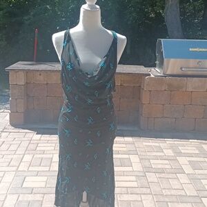 High low, teal flowers black background. Open back with criss-cross straps.